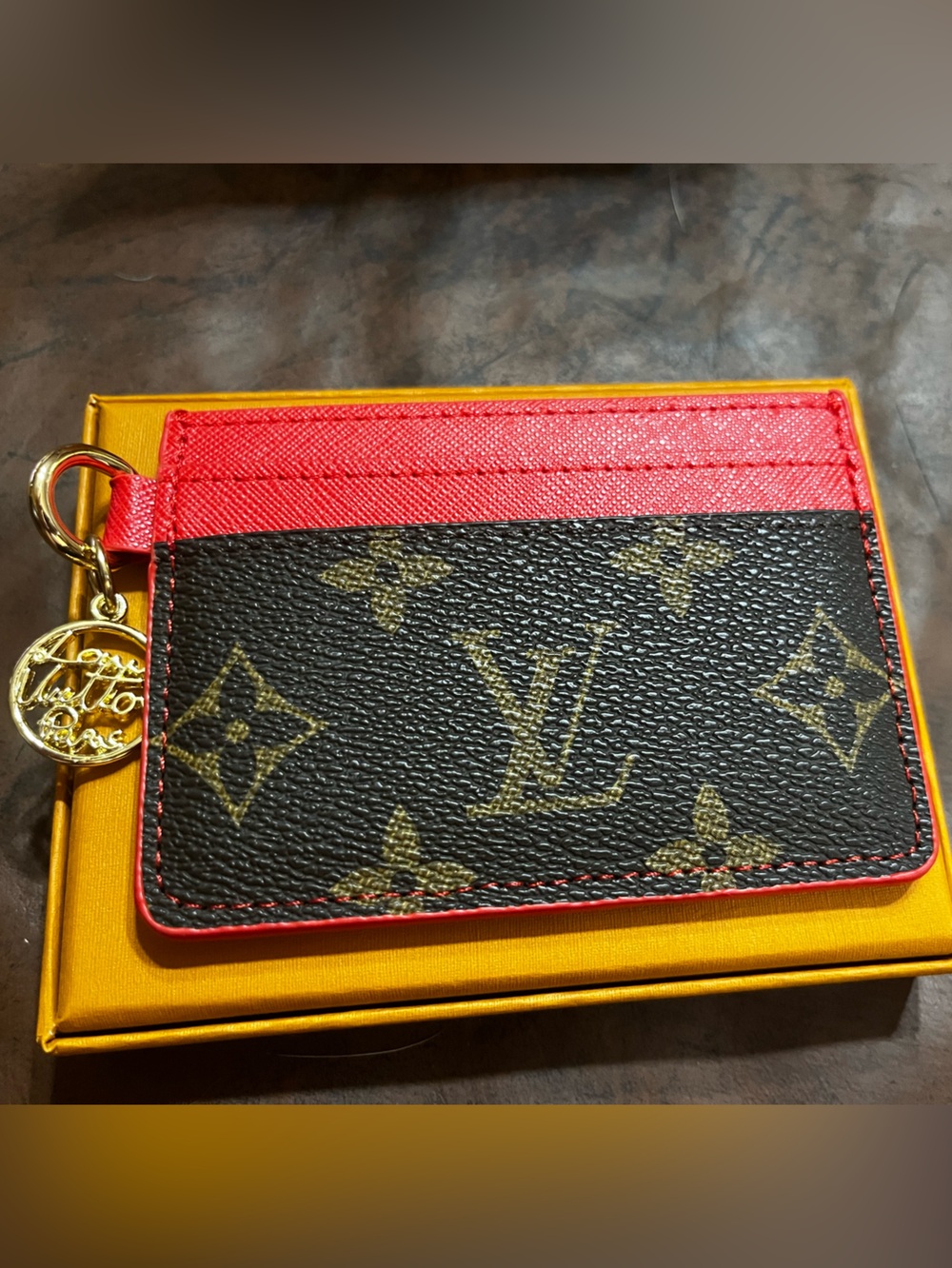 ❤️ L. V. Designer Signature Monogram Gold Tone Charm Red Trim Card Wallet